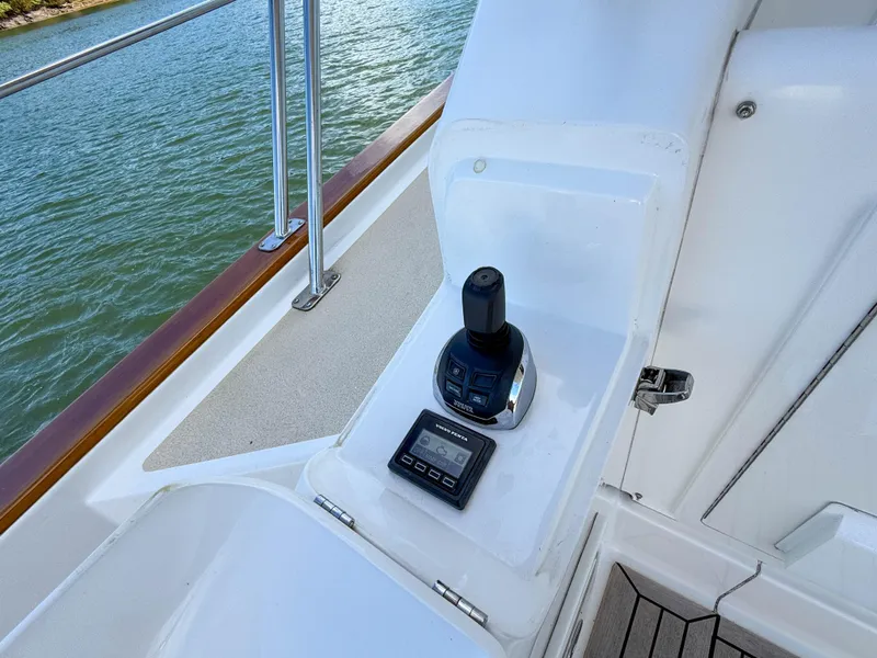 Slide: The Image of Control panel on 2014 Grand Banks 50 Eastbay SX yacht, overlooking water. - 38