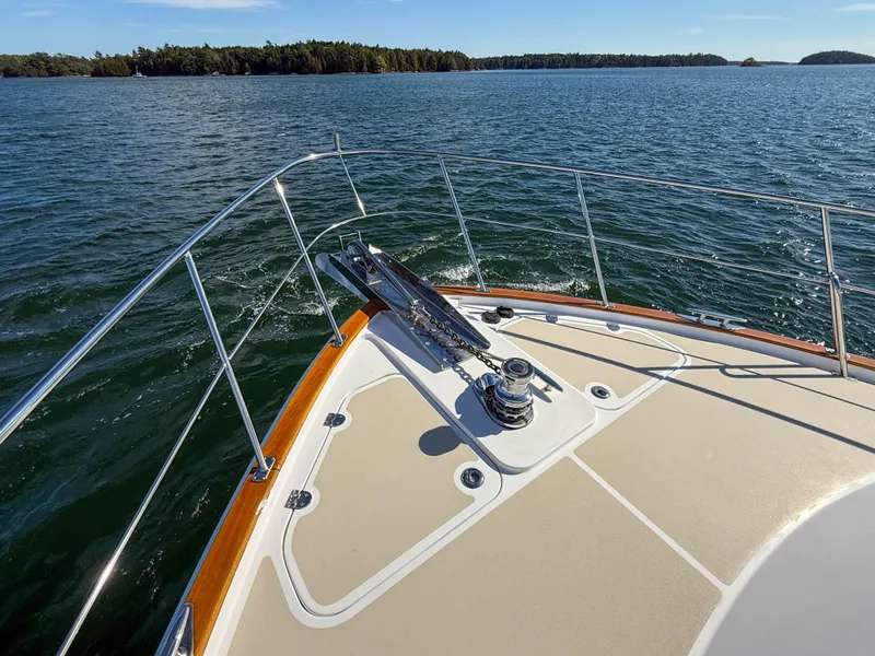 Slide: The Image of 2014 Grand Banks 50 Eastbay SX yacht bow on open water. - 43