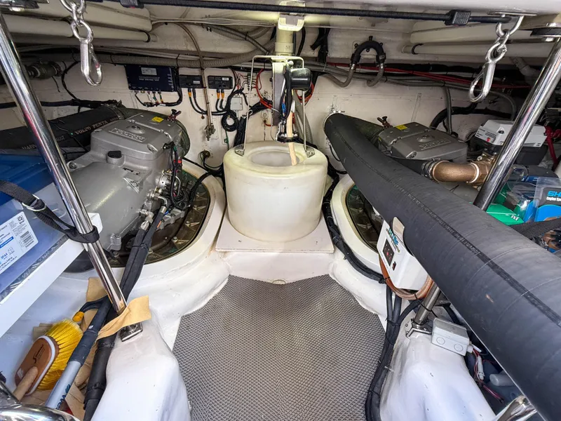 Slide: The Image of Engine room of 2014 Grand Banks 50 Eastbay SX yacht, showcasing dual engines and equipment. - 48