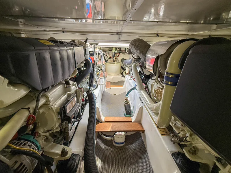 Slide: The Image of Engine room of 2014 Grand Banks 50 Eastbay SX yacht, showcasing mechanical components. - 49
