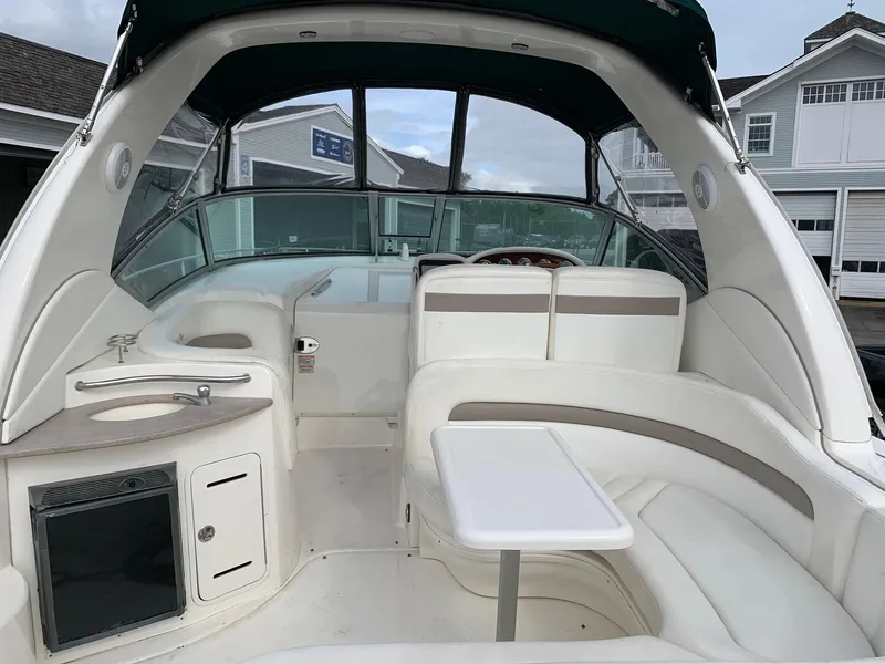 Slide: The Image of Interior of 2004 Sea Ray 320 Sundancer boat with seating and table. - 6