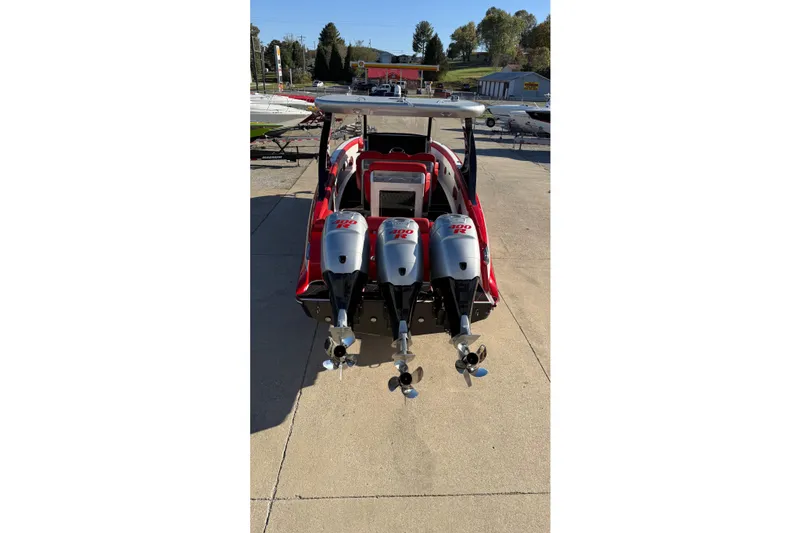 Slide: The Image of 2019 Mystic Powerboats M3800 with triple outboard engines, rear view. - 21