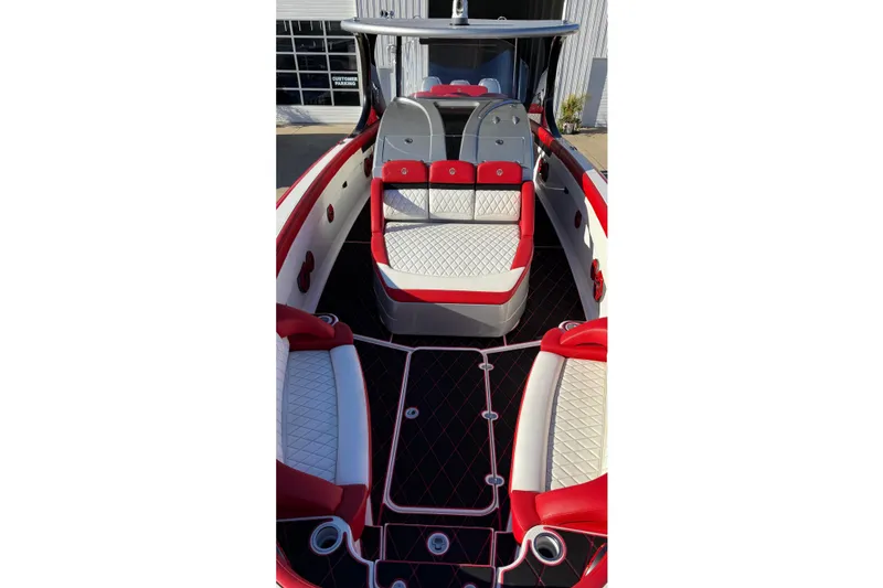 Slide: The Image of 2019 Mystic Powerboats M3800 interior with red and white seating, sleek design. - 27