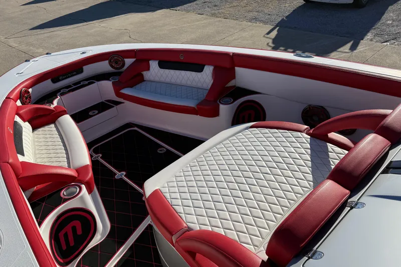 Slide: The Image of 2019 Mystic Powerboats M3800 interior with red and white seating, diamond stitching, and cup holders. - 28