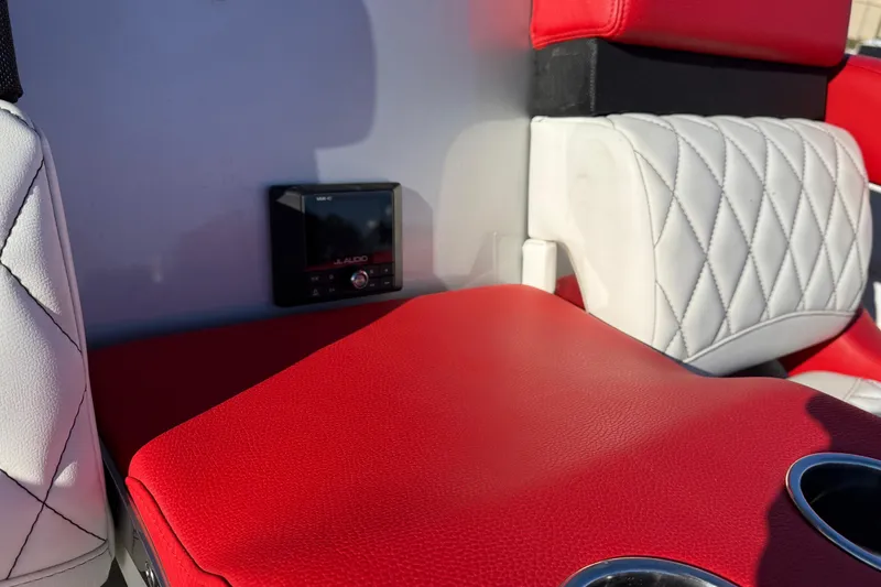 Slide: The Image of Red and white interior of 2019 Mystic Powerboats M3800 with JL Audio system. - 30