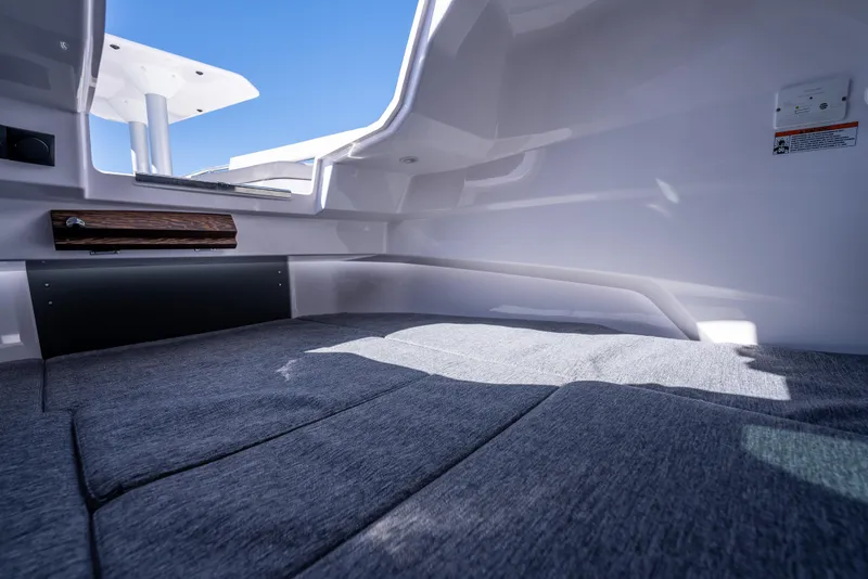 Slide: The Image of 2025 Axopar 29 XC Cross Cabin interior with modern design and comfortable seating. - 19