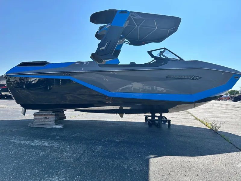 Slide: The Image of 2025 Nautique G23 Paragon boat with sleek design and blue accents on display. - 10