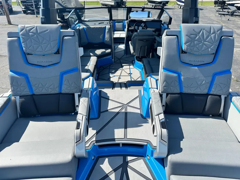 Slide: The Image of 2025 Nautique G23 Paragon boat interior with luxurious seating and modern design. - 12