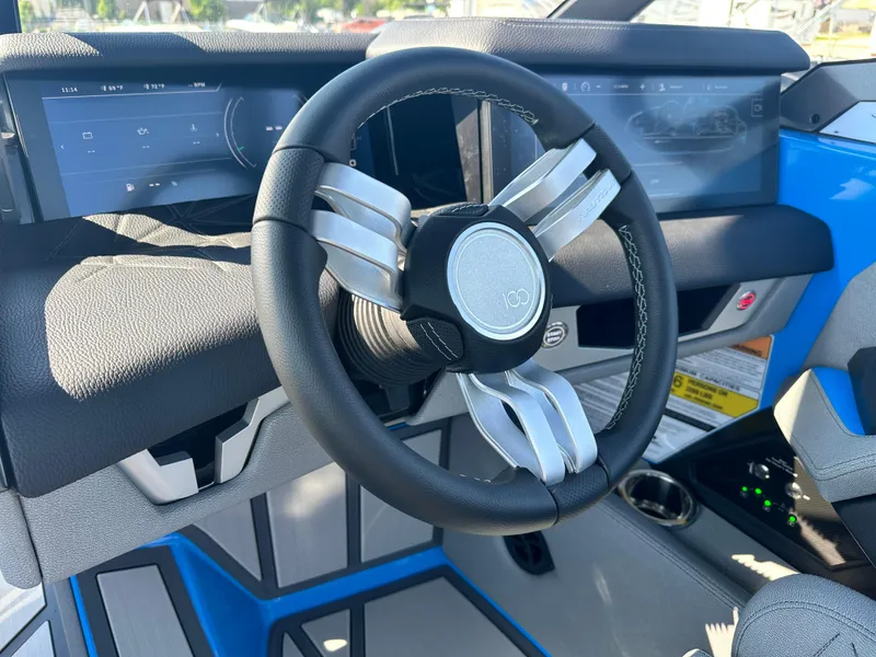 Slide: The Image of 2025 Nautique G23 Paragon steering wheel and dashboard, featuring modern design and technology. - 19