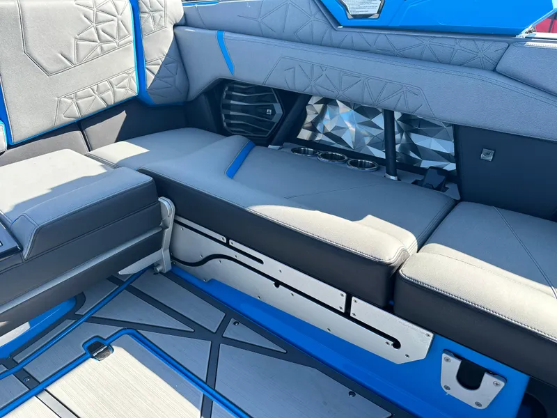 Slide: The Image of 2025 Nautique G23 Paragon interior with gray and blue seating, modern design elements. - 20