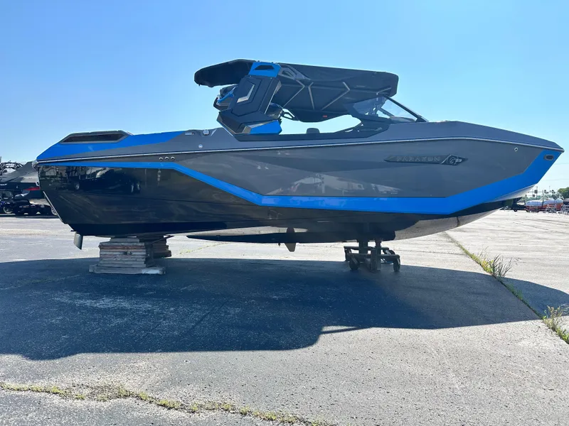 Slide: The Image of 2025 Nautique G23 Paragon boat with sleek design and blue accents on display. - 4