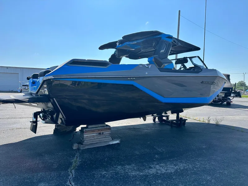 Slide: The Image of 2025 Nautique G23 Paragon boat with sleek design, blue accents, and modern features. - 5