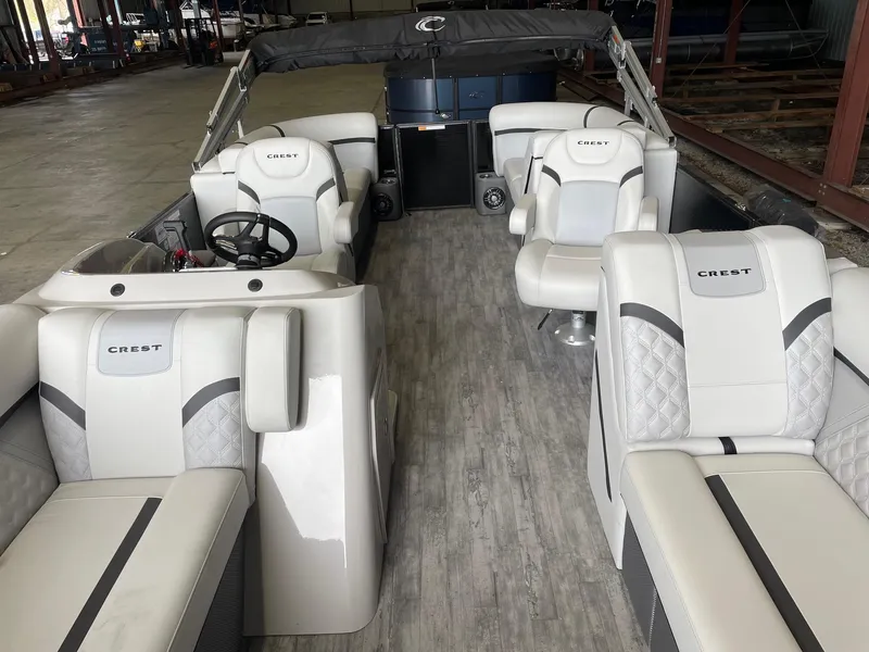 Slide: The Image of 2024 Crest 220 SLC Classic DLX boat interior with luxurious seating and modern design. - 8