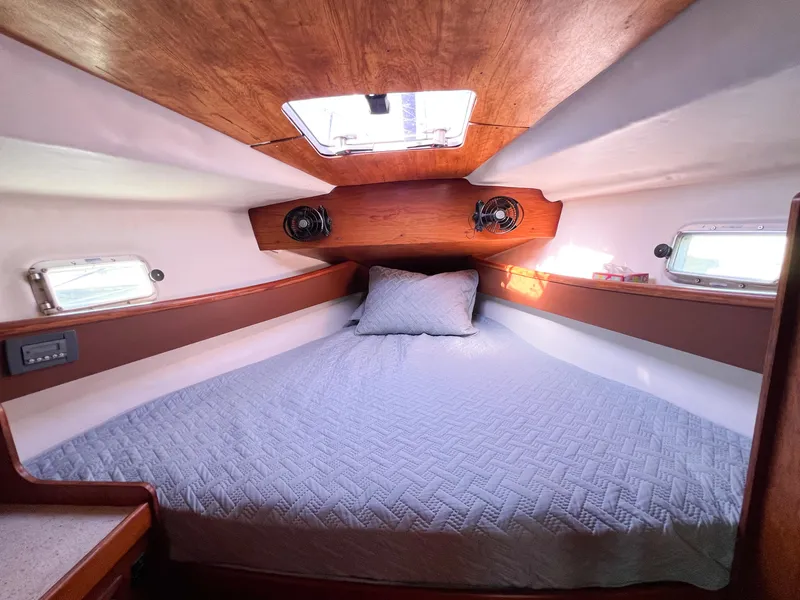 Slide: The Image of Interior of 1989 Jeanneau Voyage 11.20 yacht with cozy bed. - 12