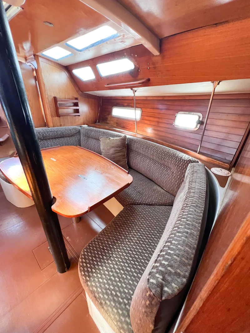 Slide: The Image of Interior of a 1989 Jeanneau Voyage 11.20 yacht with cozy seating area. - 20