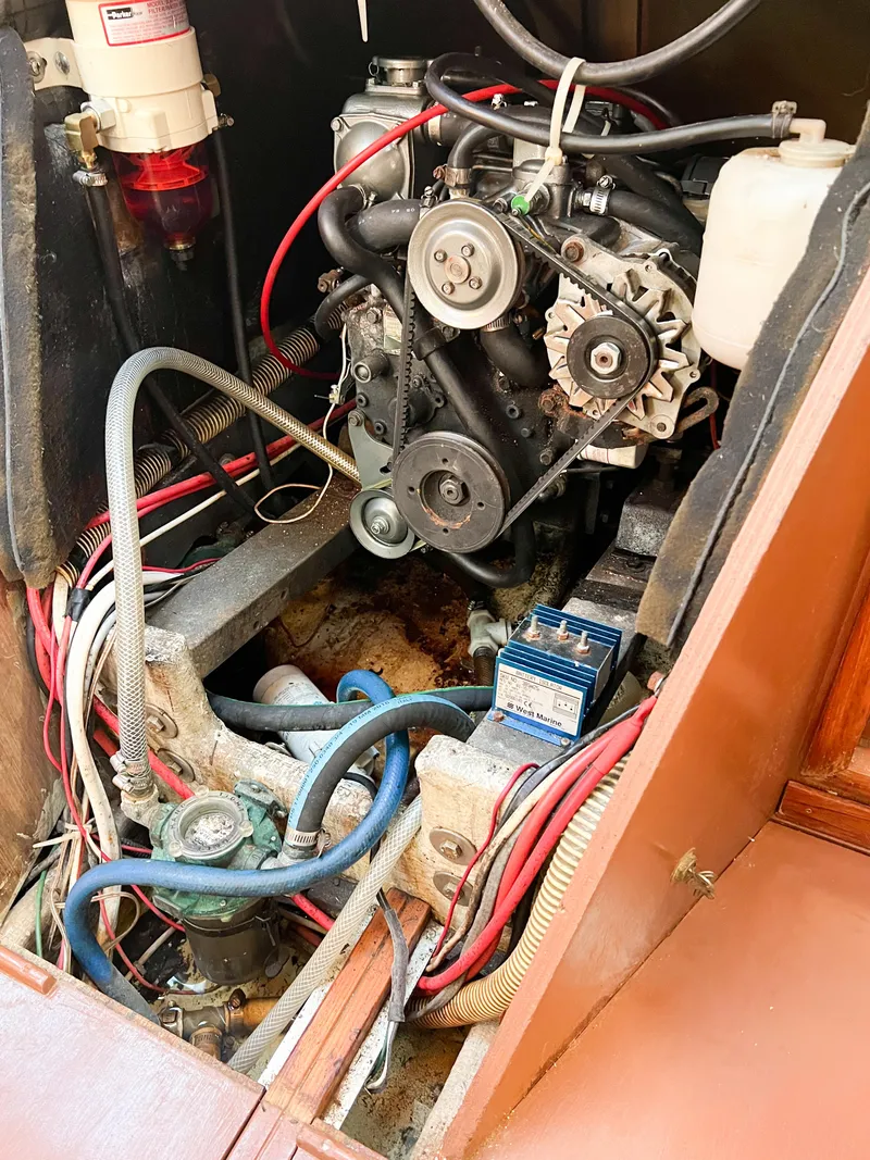 Slide: The Image of Engine compartment of a 1989 Jeanneau Voyage 11.20 with visible wiring. - 5