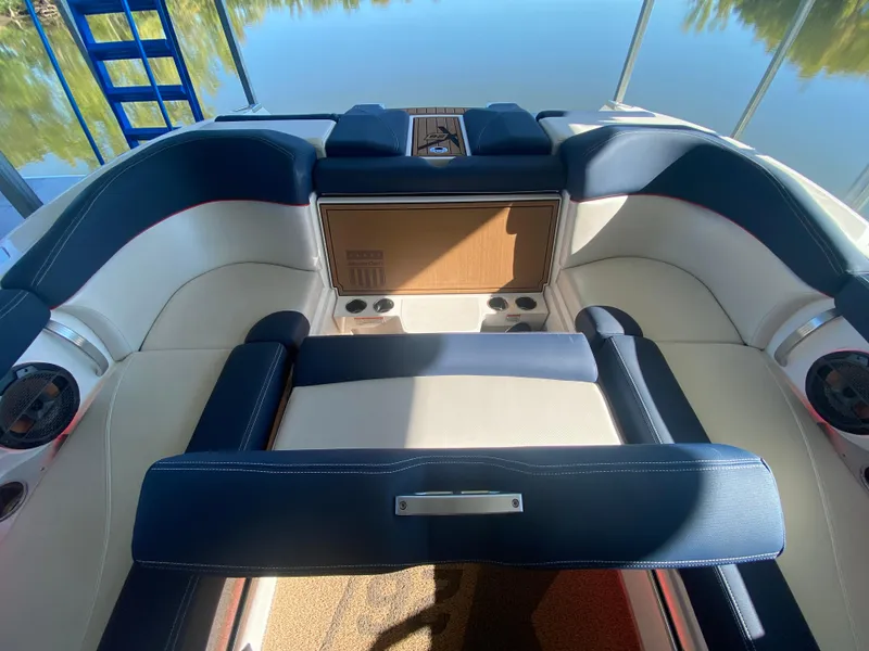 Slide: The Image of 2018 MasterCraft X26 boat interior with luxurious seating and cup holders. - 22