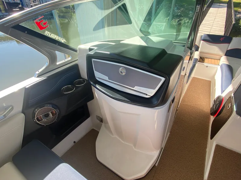 Slide: The Image of 2018 MasterCraft X26 boat interior with modern dashboard and seating. - 25