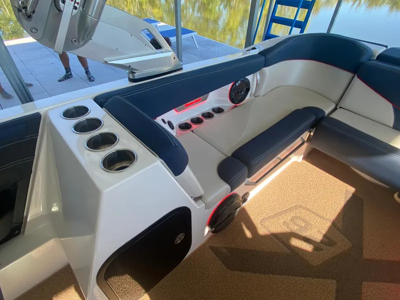Slide: The Image of 2018 MasterCraft X26 boat interior with cup holders and seating. - 28