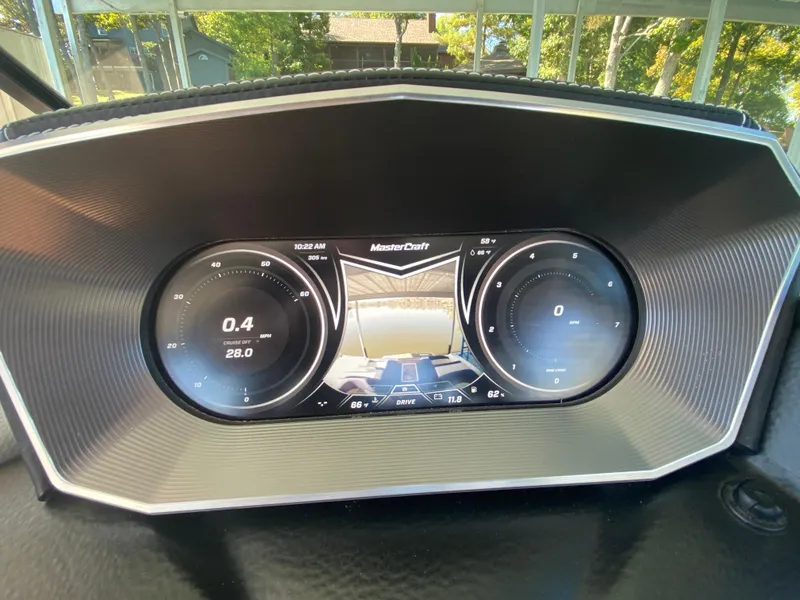 Slide: The Image of Dashboard of 2018 MasterCraft X26 boat with digital display and controls. - 32