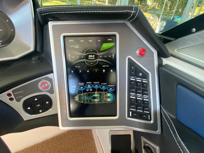 Slide: The Image of 2018 MasterCraft X26 dashboard with touchscreen controls and navigation system. - 33