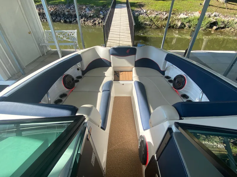 Slide: The Image of 2018 MasterCraft X26 boat interior with spacious seating and premium audio system. - 34