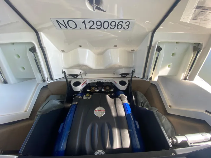 Slide: The Image of 2018 MasterCraft X26 engine compartment with open hatch, showcasing engine details. - 43