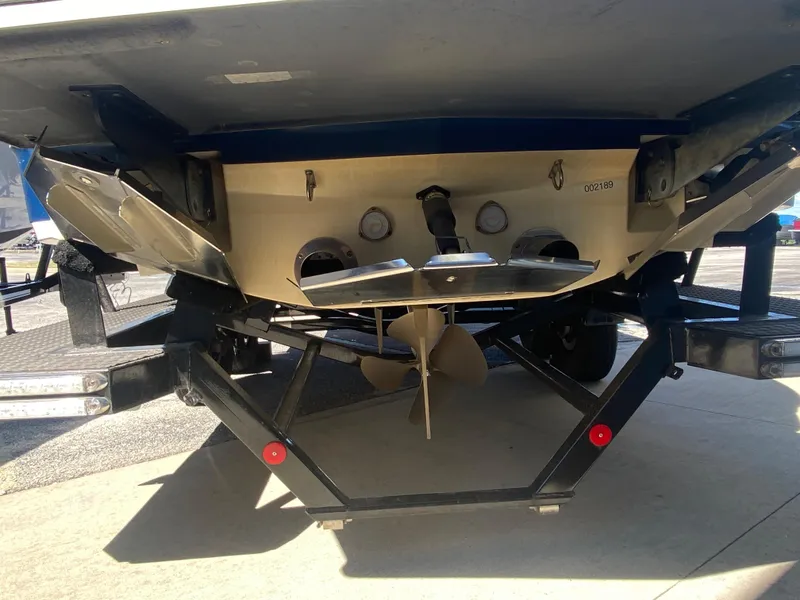 Slide: The Image of 2018 MasterCraft X26 boat stern with propeller and trailer. - 46