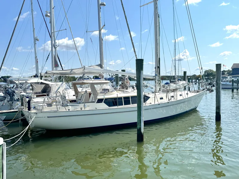 Slide: The Image of 1999 Bowman 48 Aft Cockpit sailboat docked in marina. - 1