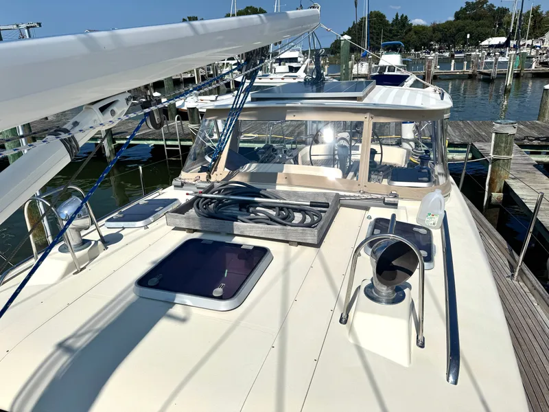 Slide: The Image of 1999 Bowman 48 Aft Cockpit yacht docked at marina. - 16
