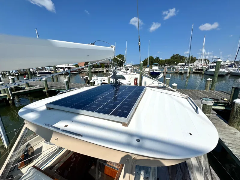 Slide: The Image of 1999 Bowman 48 Aft Cockpit with solar panel in marina. - 19