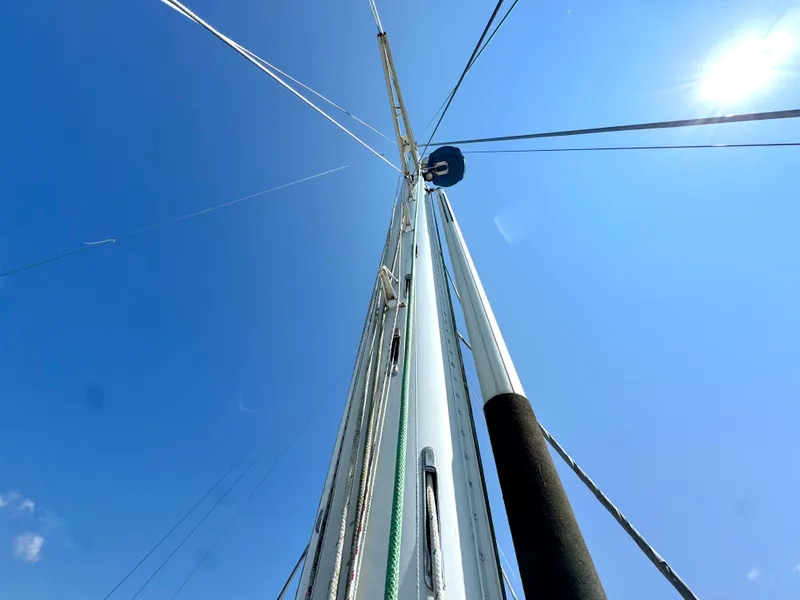 Slide: The Image of Mast of Bowman 48 Aft Cockpit sailboat, blue sky, sun, year 1999. - 28
