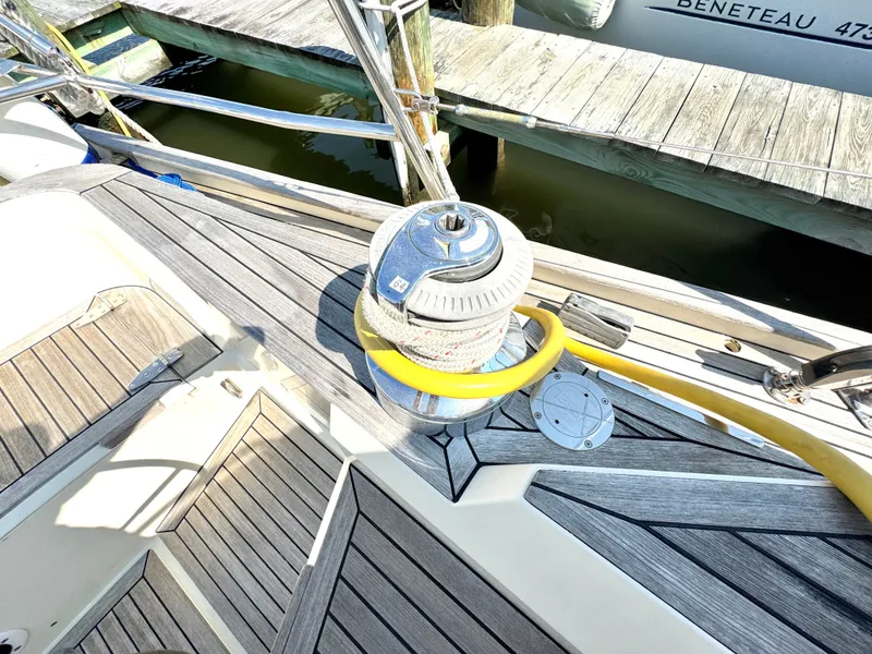 Slide: The Image of Deck of a 1999 Bowman 48 Aft Cockpit with winch and rope. - 39