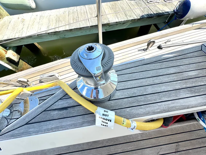 Slide: The Image of Deck of a 1999 Bowman 48 Aft Cockpit with winch and cable. - 41