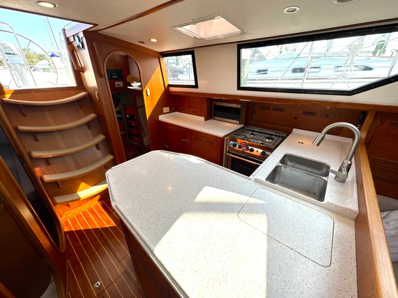 Slide: The Image of Interior view of a 1999 Bowman 48 Aft Cockpit yacht kitchen. - 44