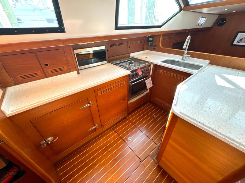Slide: The Image of Interior view of a 1999 Bowman 48 Aft Cockpit yacht kitchen. - 47