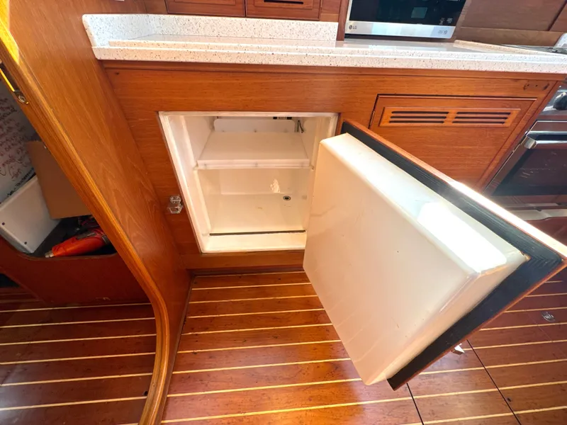 Slide: The Image of Open fridge in a 1999 Bowman 48 Aft Cockpit yacht. - 49
