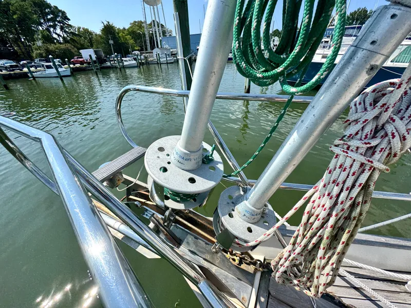 Slide: The Image of Bowman 48 Aft Cockpit 1999 with ropes and marina view. - 8