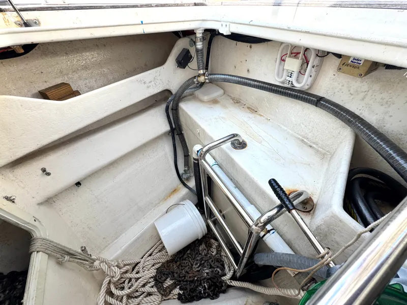 Slide: The Image of Interior view of 1999 Bowman 48 Aft Cockpit with ropes and equipment. - 9