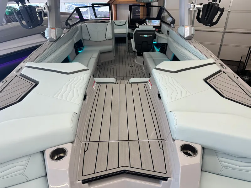 Slide: The Image of 2025 Nautique G25 boat interior with sleek seating and modern design features. - 4