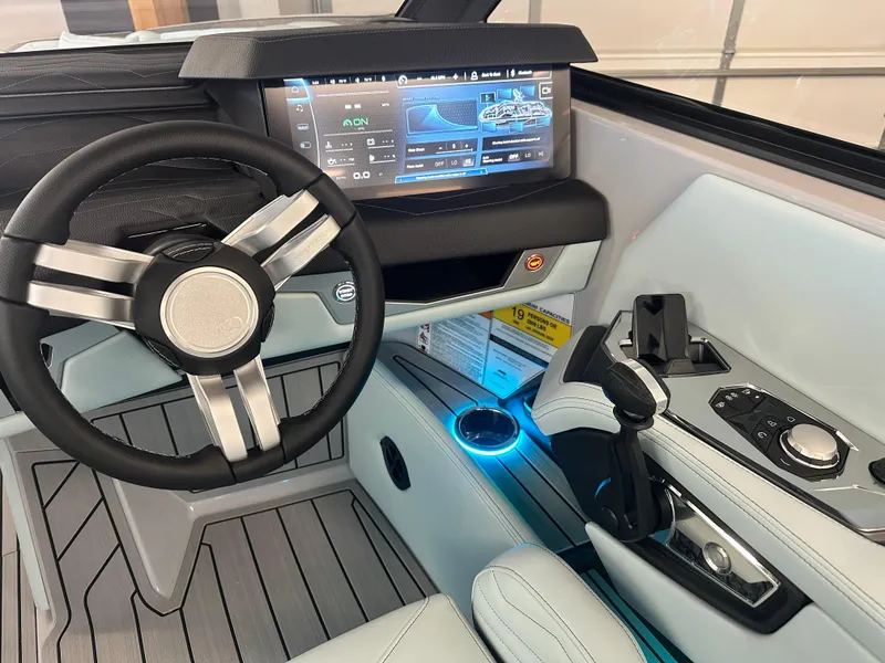 Slide: The Image of 2025 Nautique G25 boat dashboard with modern controls and digital display. - 8