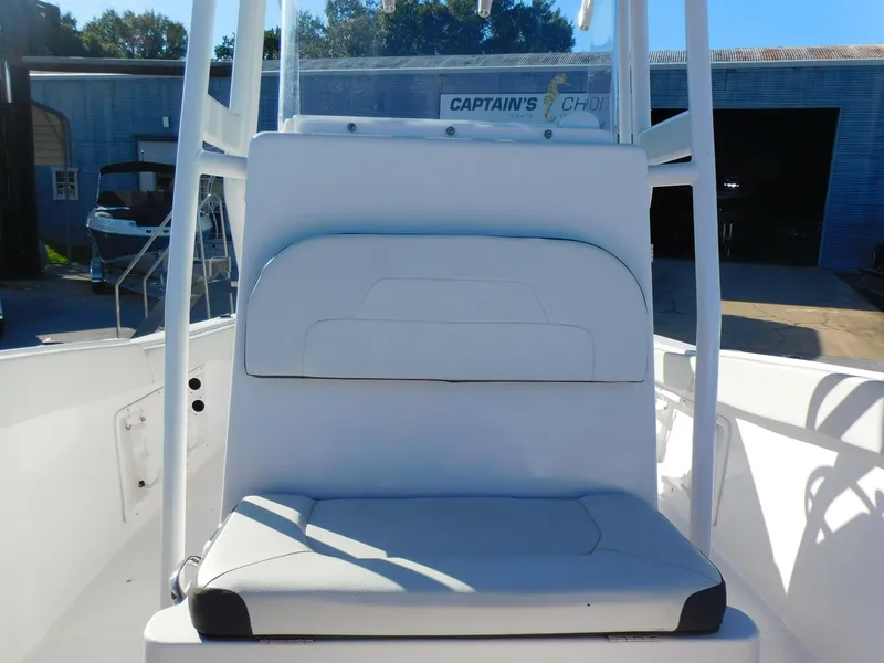 Slide: The Image of 2023 Clearwater 2200 WI Center Console boat seat in a sunny outdoor setting. - 13