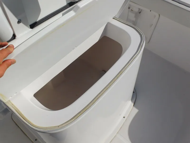 Slide: The Image of Open storage compartment on 2023 Clearwater 2200 WI Center Console boat. - 23
