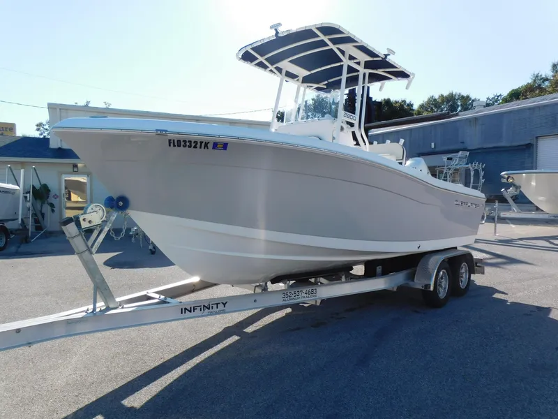 Slide: The Image of 2023 Clearwater 2200 WI Center Console boat on trailer in sunny outdoor setting. - 3