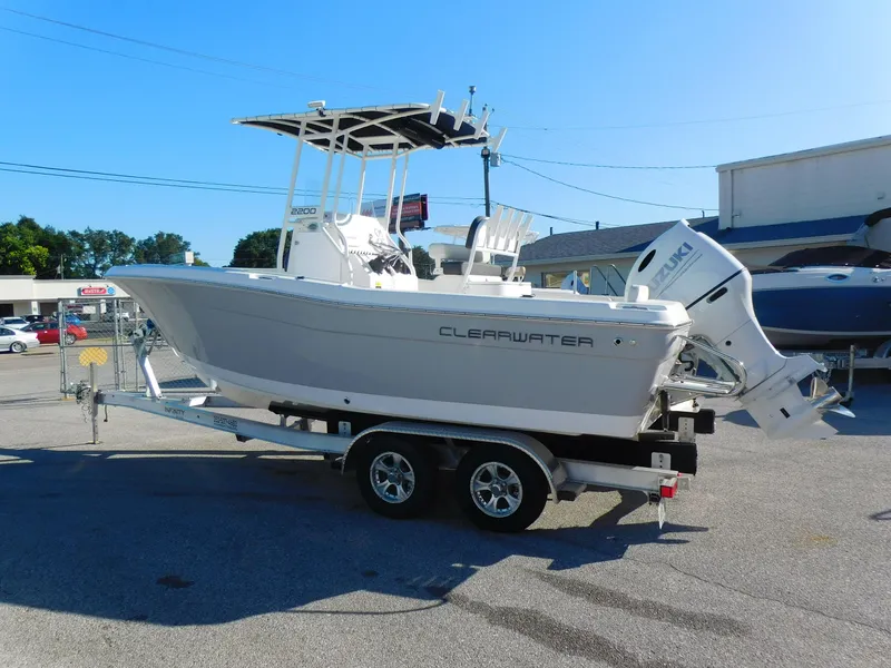 Slide: The Image of 2023 Clearwater 2200 WI Center Console boat on trailer in parking lot. - 4