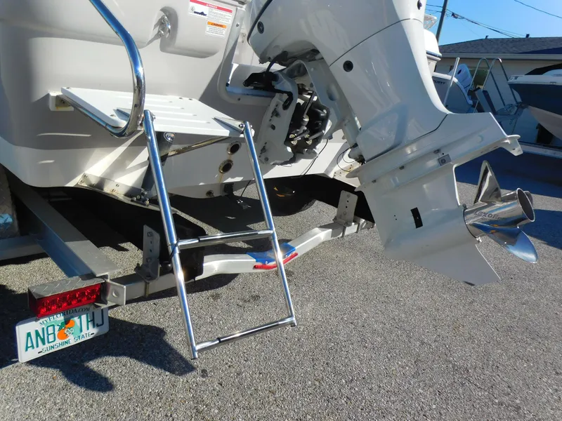 Slide: The Image of 2023 Clearwater 2200 WI Center Console boat with ladder and outboard motor. - 6