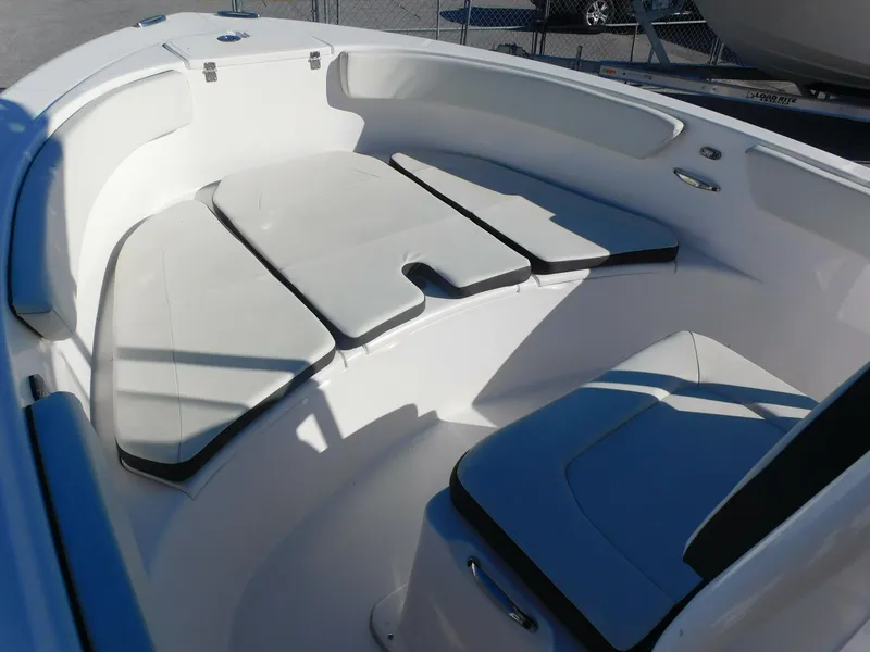 Slide: The Image of 2023 Clearwater 2200 WI Center Console boat interior with cushioned seating. - 8