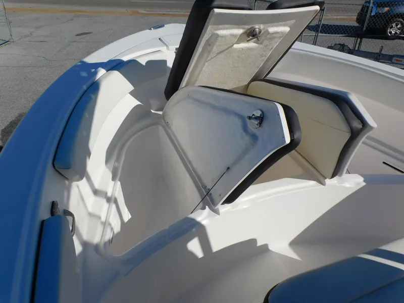 Slide: The Image of 2023 Clearwater 2200 WI Center Console boat with open storage compartments. - 9