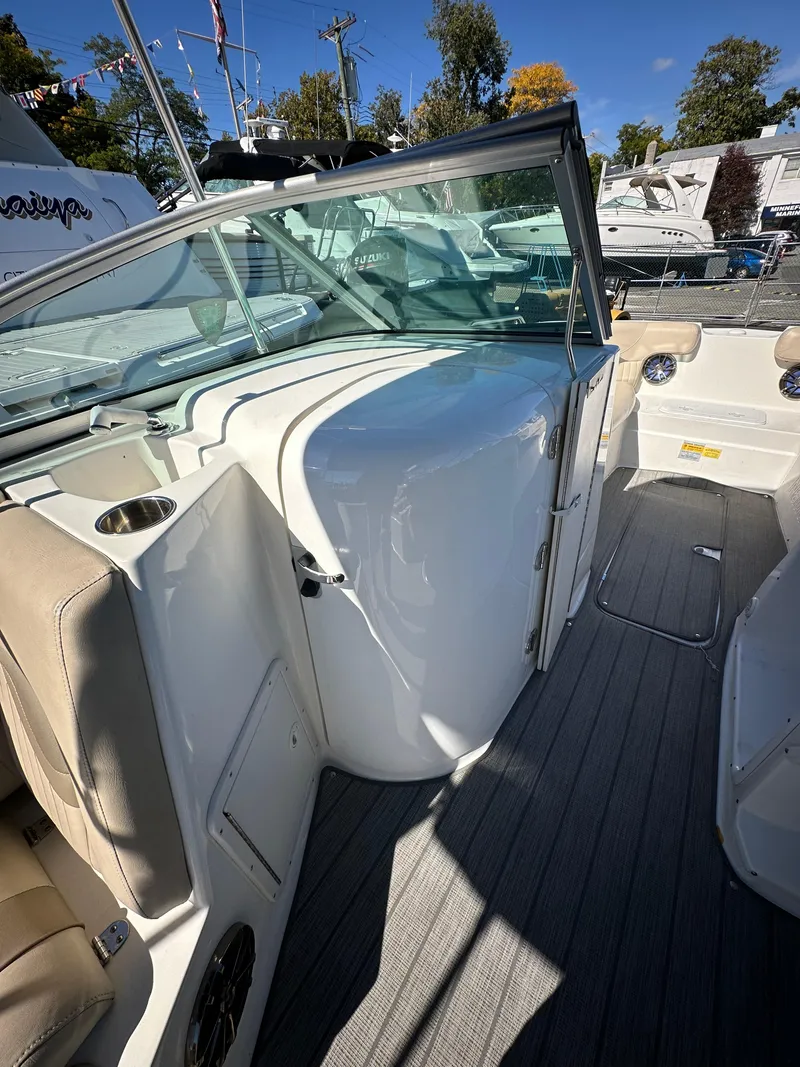 Slide: The Image of 2014 NauticStar 223DC Sport Deck boat interior with seating and storage. - 4