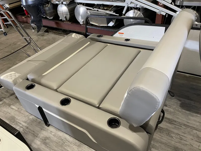 Slide: The Image of 2024 Crest 220 SLSC Classic DLX boat seating with cup holders, gray upholstery. - 6